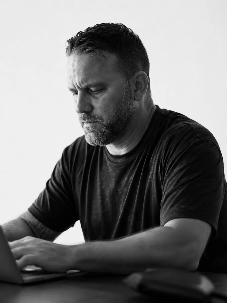 A business owner at his desk, holding it together